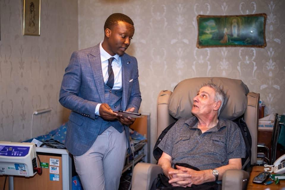 Scope Care team member talking with a client at home